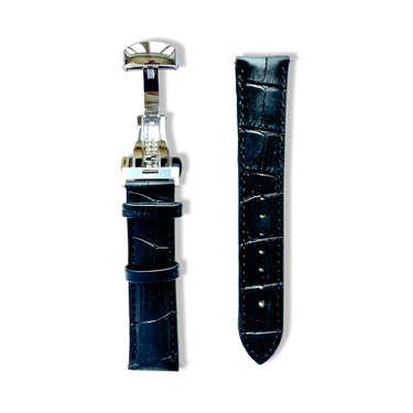 Black crocodile-patterned watch strap with silver clasp on a white background